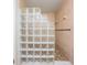 Shower stall showcasing unique glass block wall, tiled flooring, and tiled walls at 11440 Harbor Way # 5009, Largo, FL 33774