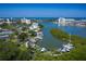 Scenic aerial view of a waterfront featuring multiple boat docks, waterways, and coastal buildings at 11440 Harbor Way # 5009, Largo, FL 33774