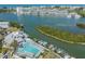 Aerial view showcases waterfront with boat docks, buildings, and a green island at 11440 Harbor Way # 5009, Largo, FL 33774