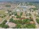 Aerial view of the property and land surrounded by a vibrant suburban community at 12009 Glenshire Dr, Riverview, FL 33579