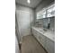 Bright bathroom featuring a vanity with marble countertop and modern faucet at 12308 Pittsfield Ave, Tampa, FL 33624