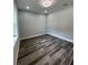 Bedroom featuring fresh paint, recessed lighting, a window for natural light, and hard wood floors at 12308 Pittsfield Ave, Tampa, FL 33624