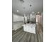 Modern kitchen with white cabinets, stainless steel appliances, a center island with a sink, and pendant lighting at 12308 Pittsfield Ave, Tampa, FL 33624
