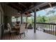 Outdoor deck area with a dining table and seating area, offering stunning views at 1296 Weybridge Ln, Dunedin, FL 34698