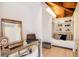 Bright home office featuring a mirrored desk, closet with custom shelves, and a daybed beneath exposed wooden beams at 1296 Weybridge Ln, Dunedin, FL 34698