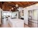 Modern kitchen with white cabinets, stainless steel appliances, and an expansive island for culinary enthusiasts at 1296 Weybridge Ln, Dunedin, FL 34698