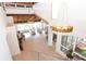 Grand living room featuring high ceilings, stylish chandeliers, and a wall of windows at 1296 Weybridge Ln, Dunedin, FL 34698