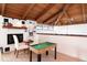 Upstairs loft features a small pool table and a fireplace at 1296 Weybridge Ln, Dunedin, FL 34698