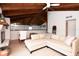 Upstairs loft features a small pool table and a comfortable seating area at 1296 Weybridge Ln, Dunedin, FL 34698