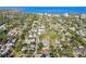 Peaceful aerial view of the neighborhood with mature trees and views of the beautiful water at 135 12Th Ne Ave, St Petersburg, FL 33701