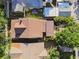 Aerial view of house showing brown roof, carport, fenced yard and hot tub at 135 12Th Ne Ave, St Petersburg, FL 33701