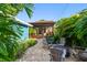 Relaxing backyard featuring brick pavers, Adirondack chairs and a pergola at 135 12Th Ne Ave, St Petersburg, FL 33701