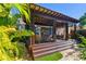 Backyard patio with lush landscaping, hot tub, daybed, and outdoor furniture at 135 12Th Ne Ave, St Petersburg, FL 33701