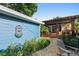 Outdoor seating area in a secluded backyard with brick pavers and lush landscaping at 135 12Th Ne Ave, St Petersburg, FL 33701