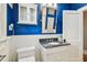 Updated bathroom with a granite countertop and white cabinets at 135 12Th Ne Ave, St Petersburg, FL 33701