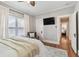 Bedroom with hardwood floors, area rug, and ceiling fan at 135 12Th Ne Ave, St Petersburg, FL 33701