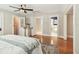 Bedroom with hardwood floors and multiple entryways to bathroom and closet at 135 12Th Ne Ave, St Petersburg, FL 33701