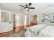 Bedroom boasts hardwood floors, ceiling fan and access to multiple rooms at 135 12Th Ne Ave, St Petersburg, FL 33701