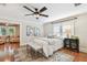 Bedroom with hardwood floors, area rug, and ceiling fan at 135 12Th Ne Ave, St Petersburg, FL 33701