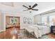 Bedroom with sitting area, hardwood floors, and ceiling fan at 135 12Th Ne Ave, St Petersburg, FL 33701