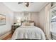 Light-filled bedroom with hardwood floors, curtains, and bedside table at 135 12Th Ne Ave, St Petersburg, FL 33701