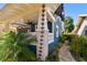 Charming blue home featuring a spacious front porch and beautifully landscaped yard at 135 12Th Ne Ave, St Petersburg, FL 33701