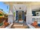 Inviting front entrance with brick steps, lion statues, and a covered porch at 135 12Th Ne Ave, St Petersburg, FL 33701