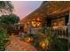 Inviting front porch with brick pathway, lion statues and manicured landscaping at 135 12Th Ne Ave, St Petersburg, FL 33701