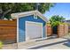 Detached one car garage featuring board and batten siding and concrete driveway at 135 12Th Ne Ave, St Petersburg, FL 33701