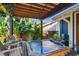 Backyard hot tub with lush landscaping, and chairs for relaxing at 135 12Th Ne Ave, St Petersburg, FL 33701