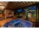 Outdoor oasis featuring a hot tub, covered patio, tropical landscaping and guest house at 135 12Th Ne Ave, St Petersburg, FL 33701