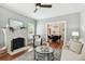 Cozy living room features a fireplace, hardwood floors, and neutral decor at 135 12Th Ne Ave, St Petersburg, FL 33701