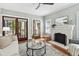Light-filled living room with access to the front porch through glass doors at 135 12Th Ne Ave, St Petersburg, FL 33701