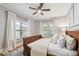 Comfortable main bedroom features a ceiling fan and two windows at 135 12Th Ne Ave, St Petersburg, FL 33701