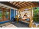 Charming patio with daybed, a ceiling fan, and access to the house via French doors at 135 12Th Ne Ave, St Petersburg, FL 33701