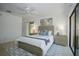 Well-lit main bedroom with a ceiling fan, neutral walls, and access to the outdoors at 13511 Avista Dr, Tampa, FL 33624