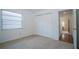 Simple bedroom with a large closet, neutral walls, and tan carpeting at 13511 Avista Dr, Tampa, FL 33624