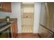 Bright laundry room connected to kitchen featuring white cabinets, tile floors, and washer/dryer at 13511 Avista Dr, Tampa, FL 33624