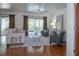 Bright living room with hardwood floors, modern furniture, and sliding glass doors to the outdoor lanai at 13511 Avista Dr, Tampa, FL 33624