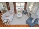 Bright living room with hardwood floors, modern furniture, and sliding glass doors to the outdoor lanai at 13511 Avista Dr, Tampa, FL 33624