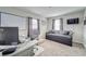 Multi-purpose bedroom with a daybed, desk and carpeted floors, providing versatility for work or relaxation at 13822 Harvestwood Ln, Riverview, FL 33569