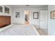 Bright bedroom featuring neutral colors, artwork and a view into an adjoining bathroom at 13822 Harvestwood Ln, Riverview, FL 33569