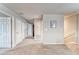 Upstairs hallway with multiple closets and doorways, leading to various rooms in the house at 13822 Harvestwood Ln, Riverview, FL 33569