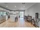 Bright kitchen featuring white cabinetry, stainless steel appliances, and an island with bar stool seating at 13822 Harvestwood Ln, Riverview, FL 33569