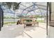 Relaxing outdoor patio featuring a bar, ping pong table, and yard games at 13822 Harvestwood Ln, Riverview, FL 33569