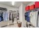 Spacious walk-in closet with ample shelving and hanging space for organized storage solutions at 13822 Harvestwood Ln, Riverview, FL 33569
