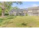 Spacious screened backyard with well-maintained lawn and lush landscaping offers a private outdoor retreat at 13934 Clubhouse Cir # 8, Tampa, FL 33618
