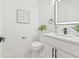 Modern bathroom features a stylish vanity, matte black hardware, and ample lighting at 13934 Clubhouse Cir # 8, Tampa, FL 33618