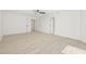 Bedroom boasts wood flooring, a ceiling fan, and two closet doors at 13934 Clubhouse Cir # 8, Tampa, FL 33618
