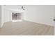 Bright bedroom features light wood flooring, fan and sliding glass door to outdoor balcony at 13934 Clubhouse Cir # 8, Tampa, FL 33618